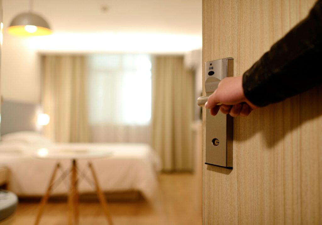 pexels-photo-271639-271639 A soft-lit hotel room entrance, welcoming guests with luxury appeal and comfort.